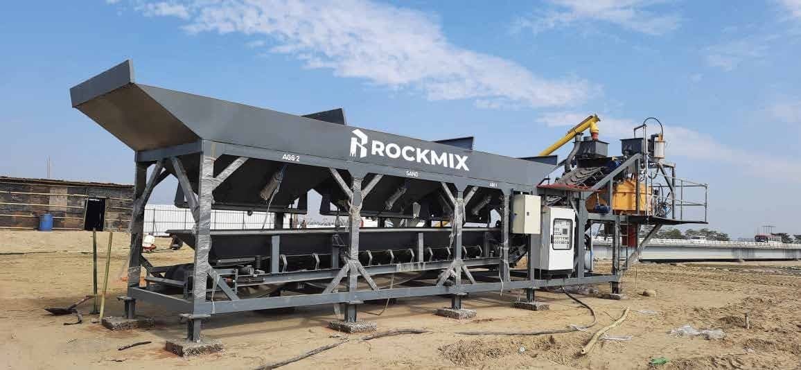 RCMP inline compact plant on site with three inline bins and control panel