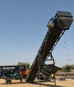 RMP plant with an inclined load-out conveyor for transit mixer loading